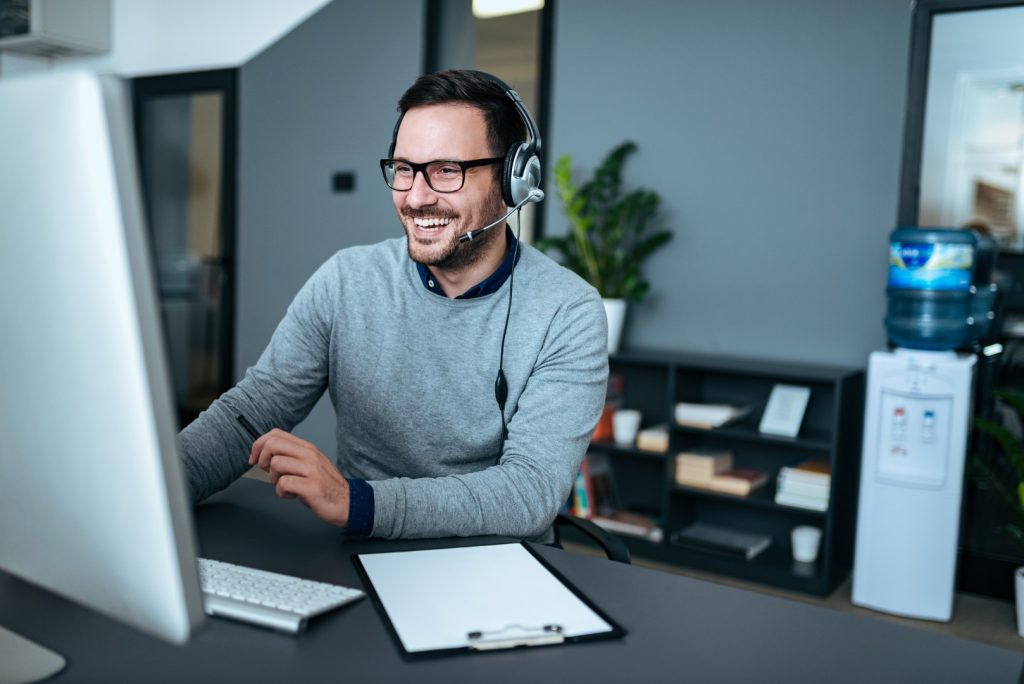 Man smiling while providing IT Support